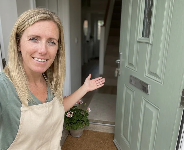 Chantelle Barratt welcoming a customer at a Repton front door